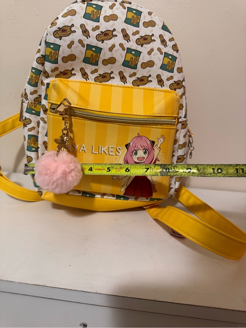 Anya Likes Peanuts Yellow Kids Backpack with Pom Pom Charm - Picture 10 of 11